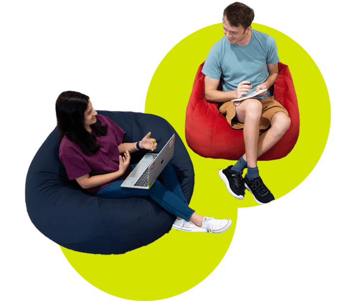 Colleagues sitting in bean bags and chatting. 