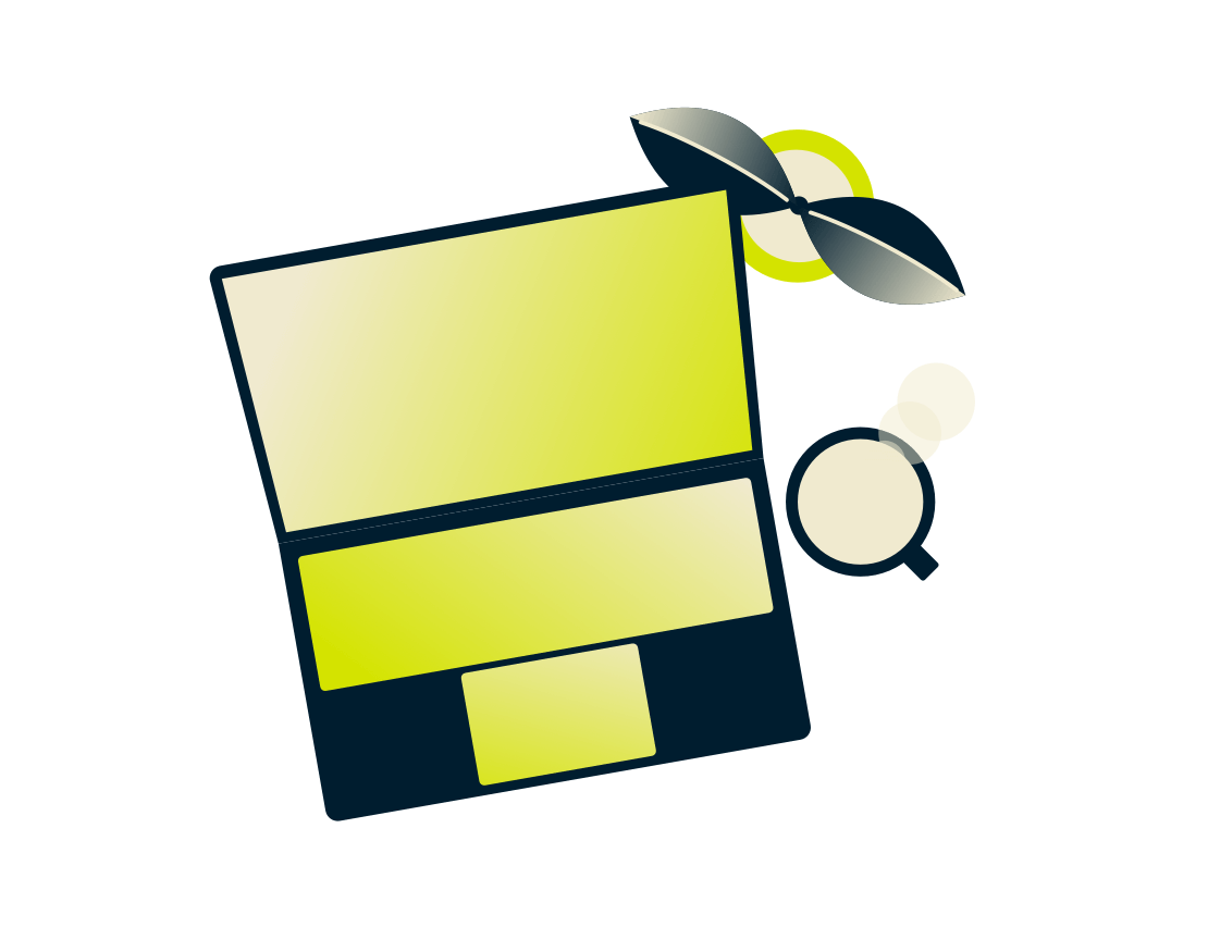 Computer portatile con una pianta e una bevanda.