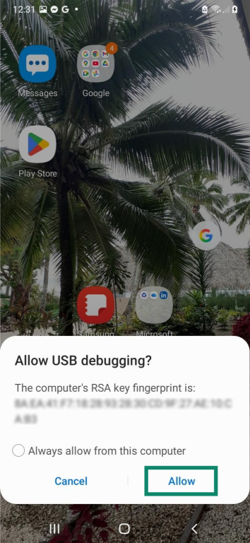 An Android home screen, with the "Allow USB debugging?" prompt message shown on top of it. The "Allow" button is highlighted.