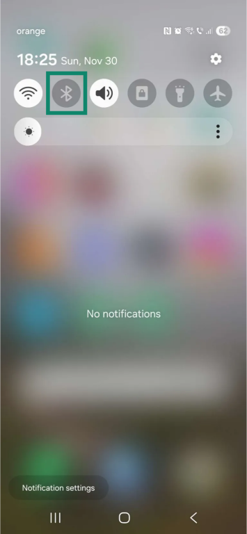 Android home screen with the notifications window swiped down. The "Bluetooth" icon is highlighted.