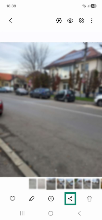 A photo in an Android phone's gallery. The share icon at the bottom is highlighted.