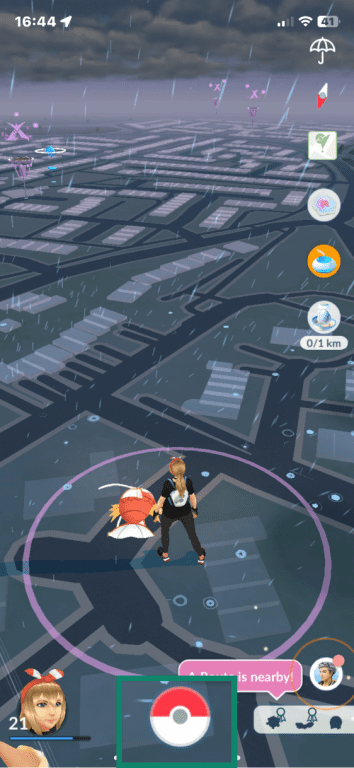 Pokémon GO on iOS highlighting Pokéball menu option