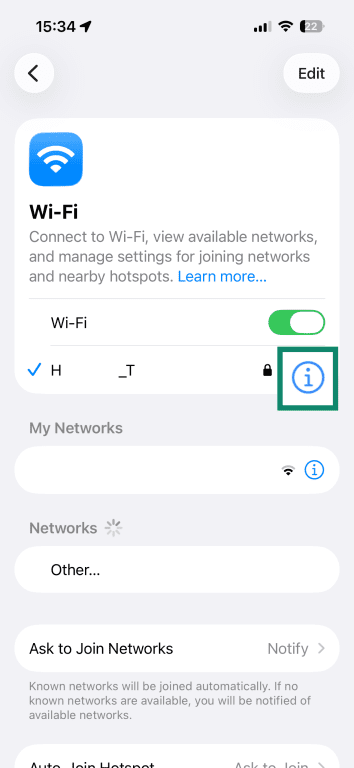 iPhone Wi-Fi settings page with the connected network selected and the information icon highlighted.