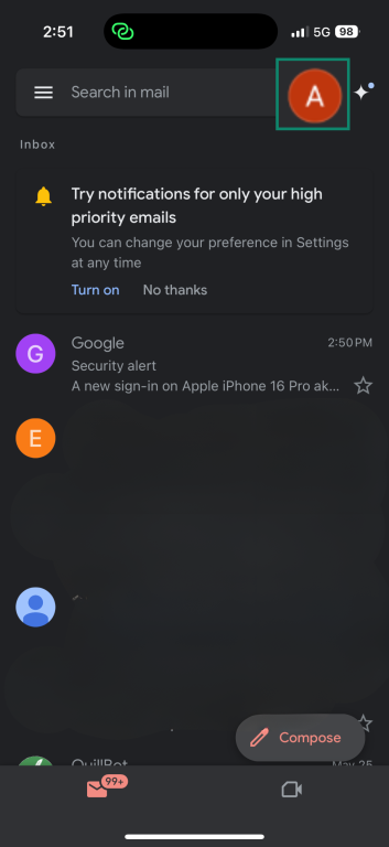 Gmail app interface on iPhone showing user profile icon in the top right corner.