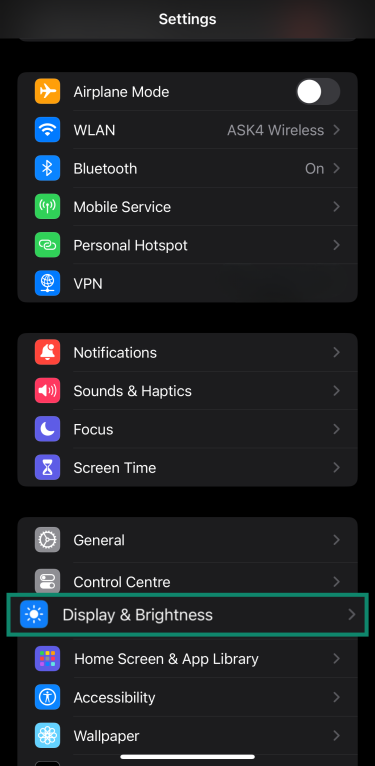 Accessing Display & Brightness settings on an iPhone through the settings menu