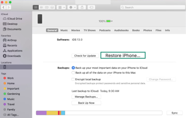 The General tab of an iPhone in Finder, showing the Restore iPhone option.